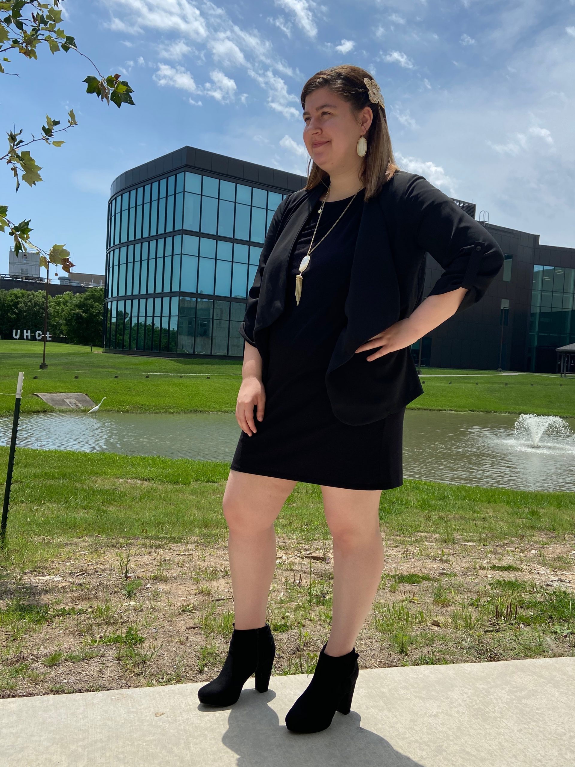 PHOTO: Signal reporter wearing a black dress, blazer, black booties, a necklace, earrings and a hair piece for a formal look. Photo by The Signal reporter Jenna Schaub