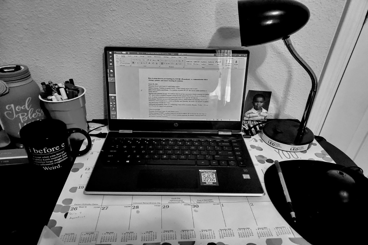 PHOTO: Photo of a laptop and desk space being used to work at home. Photo by The Signal reporter, Kiundra Jones.