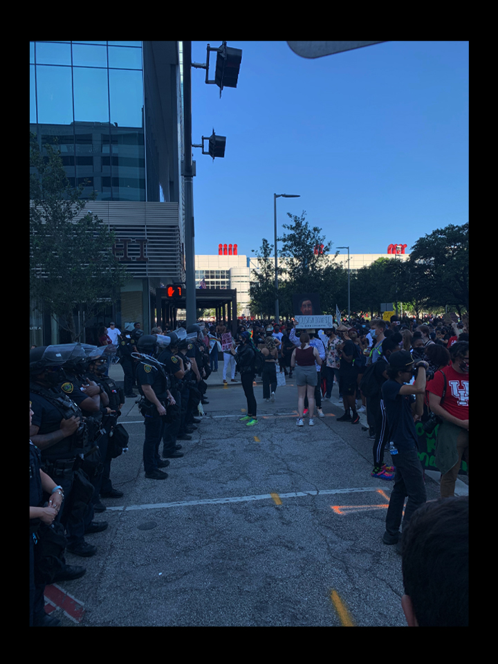 PHOTO: Participants in the June 2 Houston march standing in front of police officers.