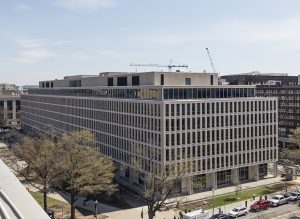PHOTO: Corner photo of the Department of Education building. Some cars line the street. Photo courtesy U.S. General Services Administration. SOURCE: https://www.gsa.gov/real-estate/gsa-properties/visiting-public-buildings/lyndon-baines-johnson-building/image-galleries/lbj-building-architecture-gallery