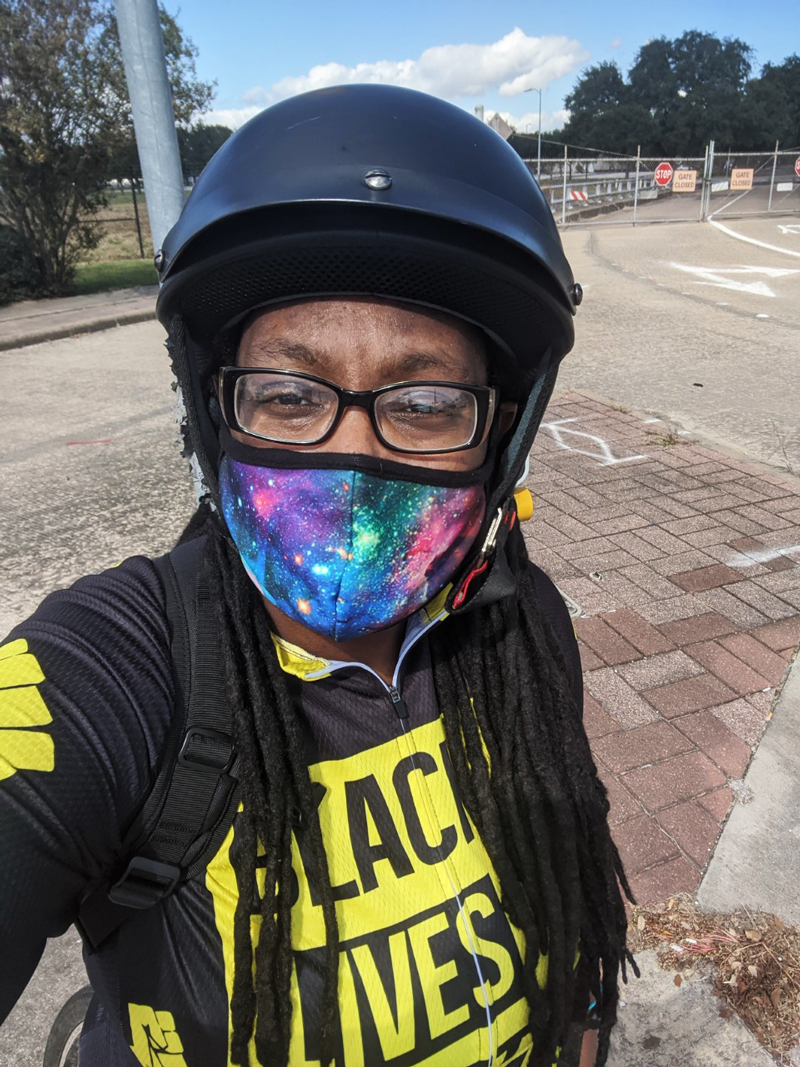 PHOTO: Atalanda biking around town in her Black Lives Matter jersey. Photo courtesy of Atalanda Cameron.