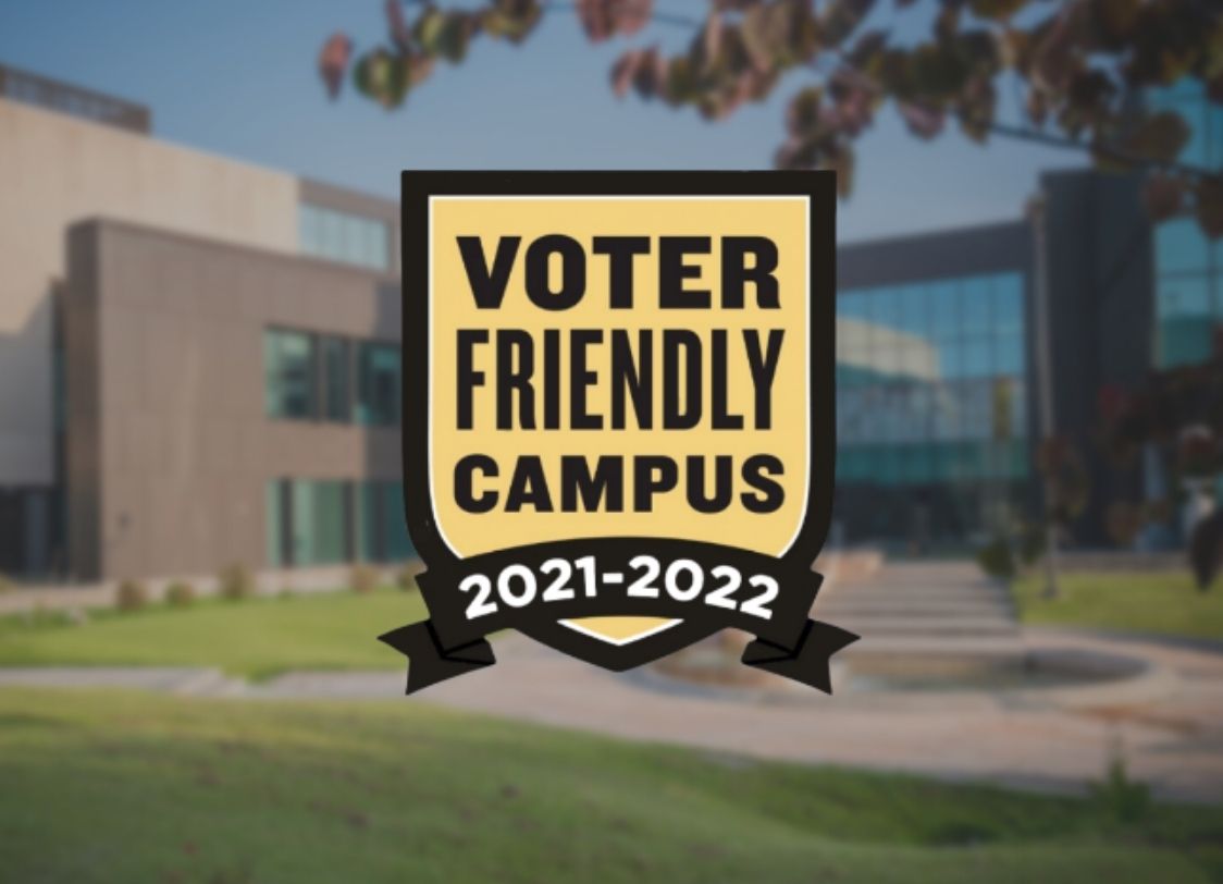 GRAPHIC: Voter Friendly Campus seal in front of blurred image of the SSCB. Graphic by The Signal Managing Editor of Outreach Stephanie Perez.