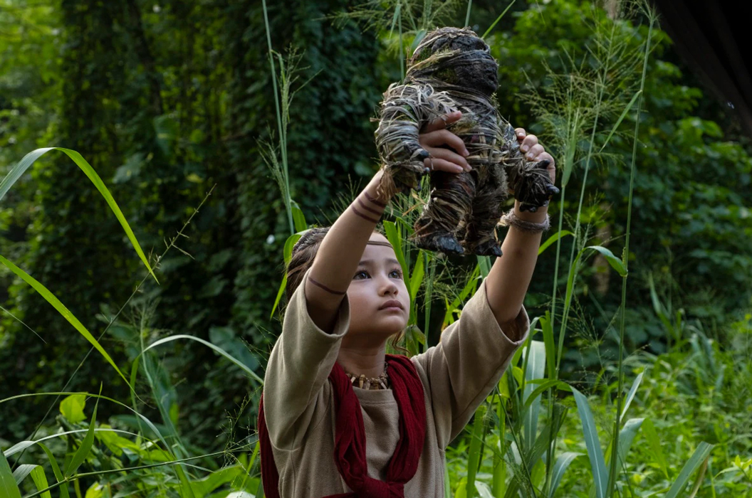 IMAGE: Kaylee Hottle in her role as Jia holding Kong-like figure. Image courtesy of Legendary Pictures and Warner Bros. Pictures. SOURCE: https://lshf.org/news/young-deaf-actress-stars-in-godzilla-vs-kong