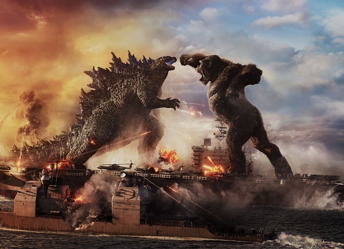 IMAGE: Godzilla and King Kong fighting on top of a carrier ship. Image courtesy of Legendary Pictures and Warner Bros. Pictures. SOURCE: https://deadline.com/wp-content/uploads/2021/01/GODZILLA-VS.-KONG-1.jpg
