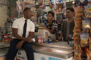 PHOTO: Benny (Corey Hawkins) visiting Usnavi (Anthony Ramos) and Sonny (Gregory Diaz IV) at their bodega. Photo courtesy of Macall Polay and Warner Bros. Entertainment Inc.