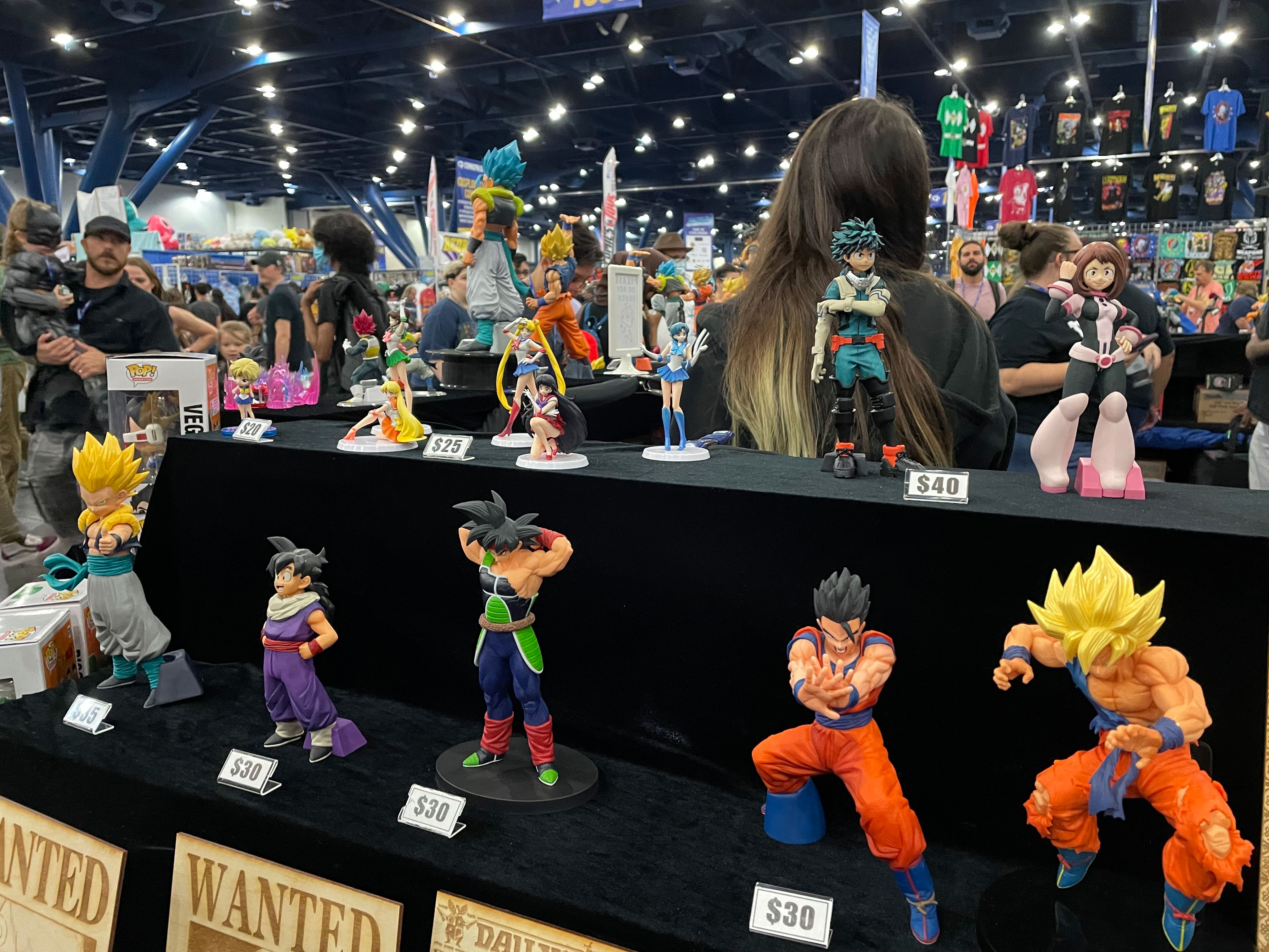 PHOTO: Image depicts multiple Dragon Ball Z action figures at the convention Comic Palooza. Multiple people can be seen in the background. Photo by The Signal Managing Editor of Content and Operations Troylon Griffin II.