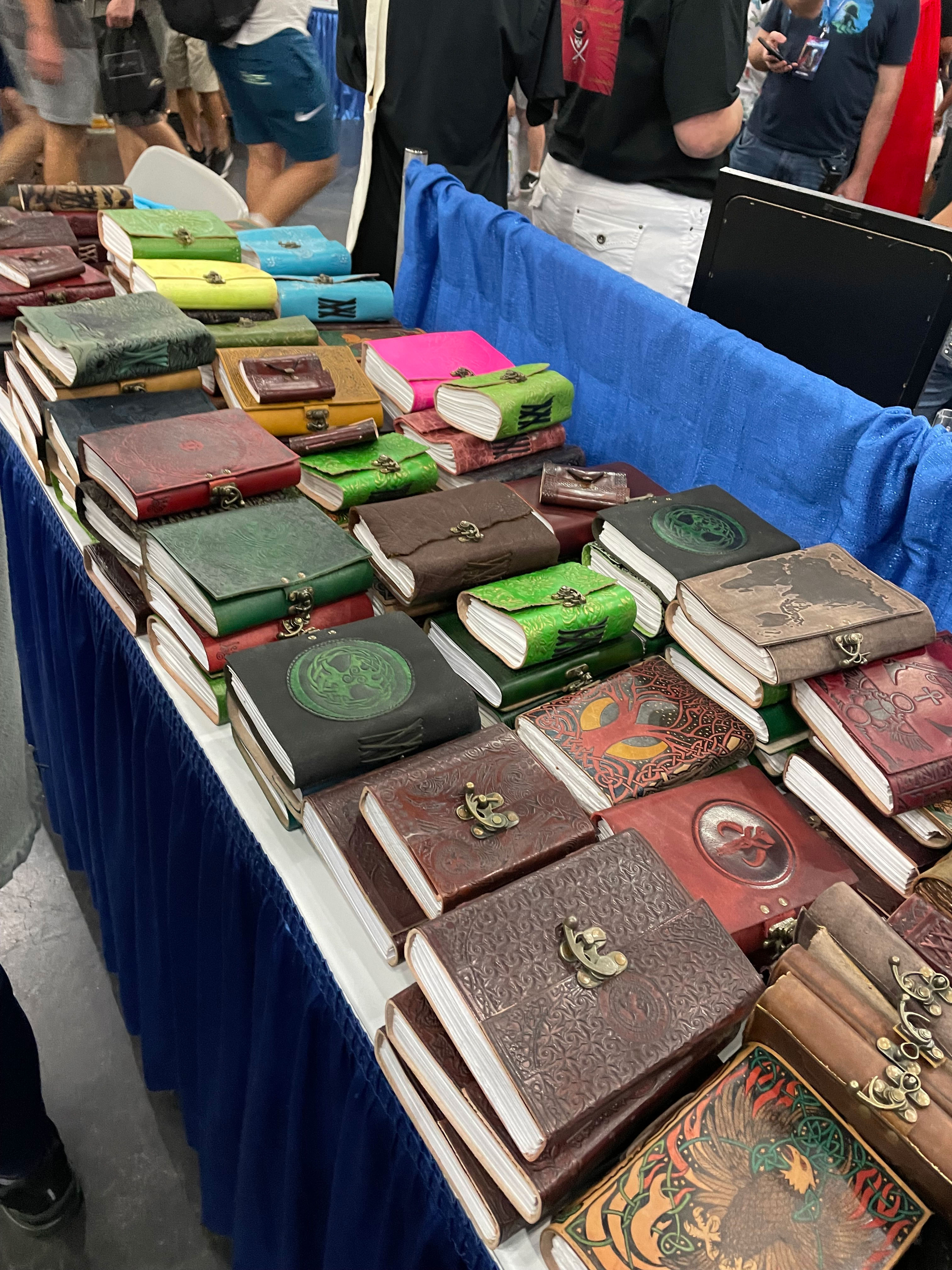 PHOTO: Image depicts an array of classic looking journals on a table with blue curtains. Photo by The Signal Managing Editor of Content and Operations Troylon Griffin II.