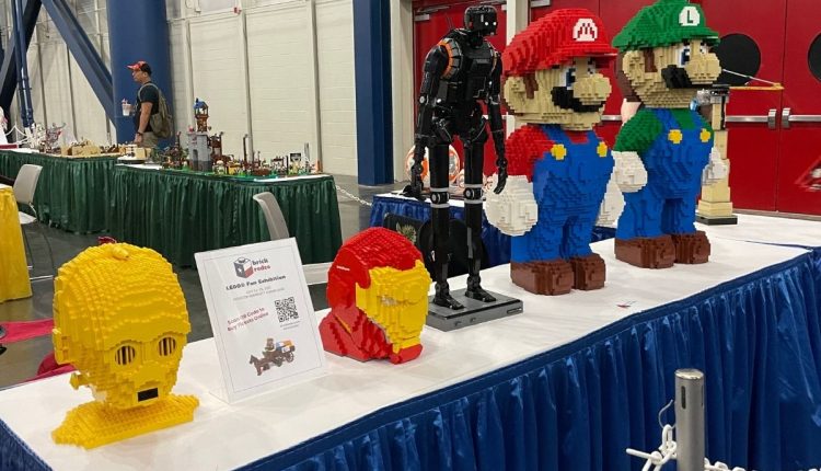 PHOTO: Lego sculptures sitting on a table. From left to right C-3PO head, Iron Man head, K-2SO and Mario and Luigi. Photo by Audience Engagement Editor Stephanie Perez.