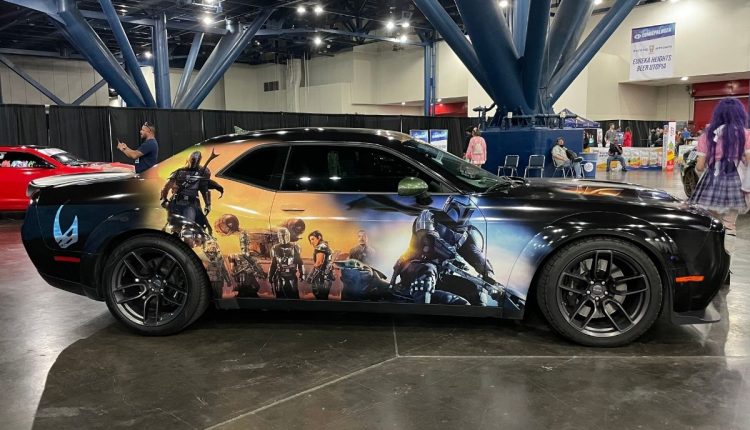 PHOTO: Side of black car with the door wrapped with characters from Disney's The Mandalorian. Photo by Audience Engagement Editor Stephanie Perez.