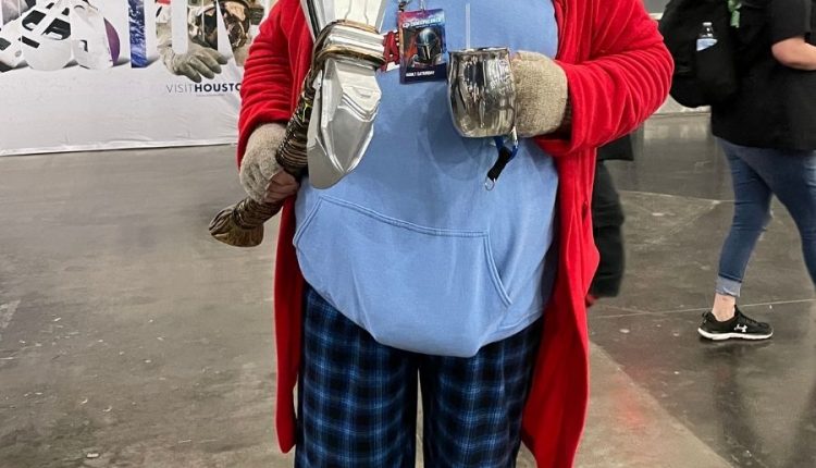 PHOTO: Man wearing pajamas, sunglasses and holding a hammer on his right hand. Photo by Audience Engagement Editor Stephanie Perez.