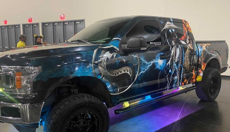 PHOTO: A showcase of a truck with a Mortal Kombat wrap. Photo by Editor-in-Chief Emily Nichelle Wolfe.