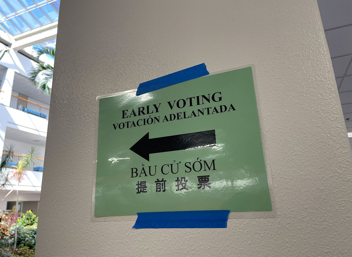 PHOTO: Photo depicts green sign that says "EARLY VOTING" in multiple languages with an arrow pointing left to direct voters to the right location. Photo by The Signal Managing Editor of Content & Operations Troylon Griffin II.