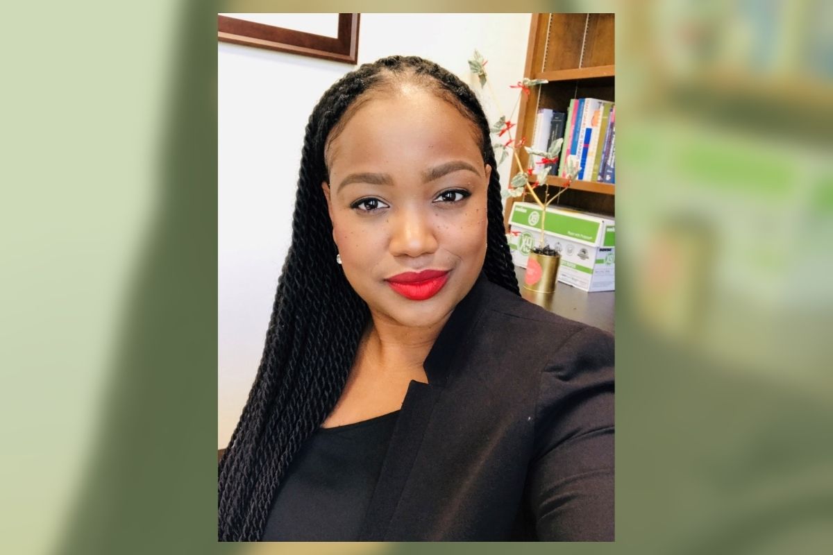 GRAPHIC: Picture of LaToya Mills-Thomas, student advocate and associate director of the Office of Student Advocacy. In the background, the image is blurred with a light green overlay. Photo courtesy of LaToya Mills-Thomas.
