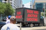 PHOTO: A group of vans with screens on the side. This truck currently reads “Gun Money” and “There was another shooting” Photograph by The Signal Managing Editor Cesar Cardenas.