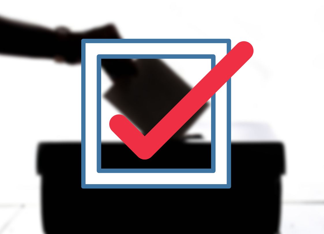 GRAPHIC: A blurred picture of some one casting a vote into a ballot box with a red check mark over the image.