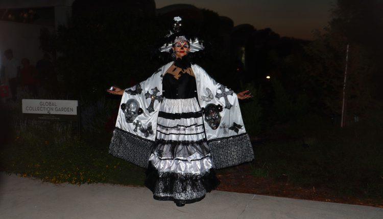 Catrina model with skulls and crosses at The Festival in the Garden at the Houston Botanic Garden.