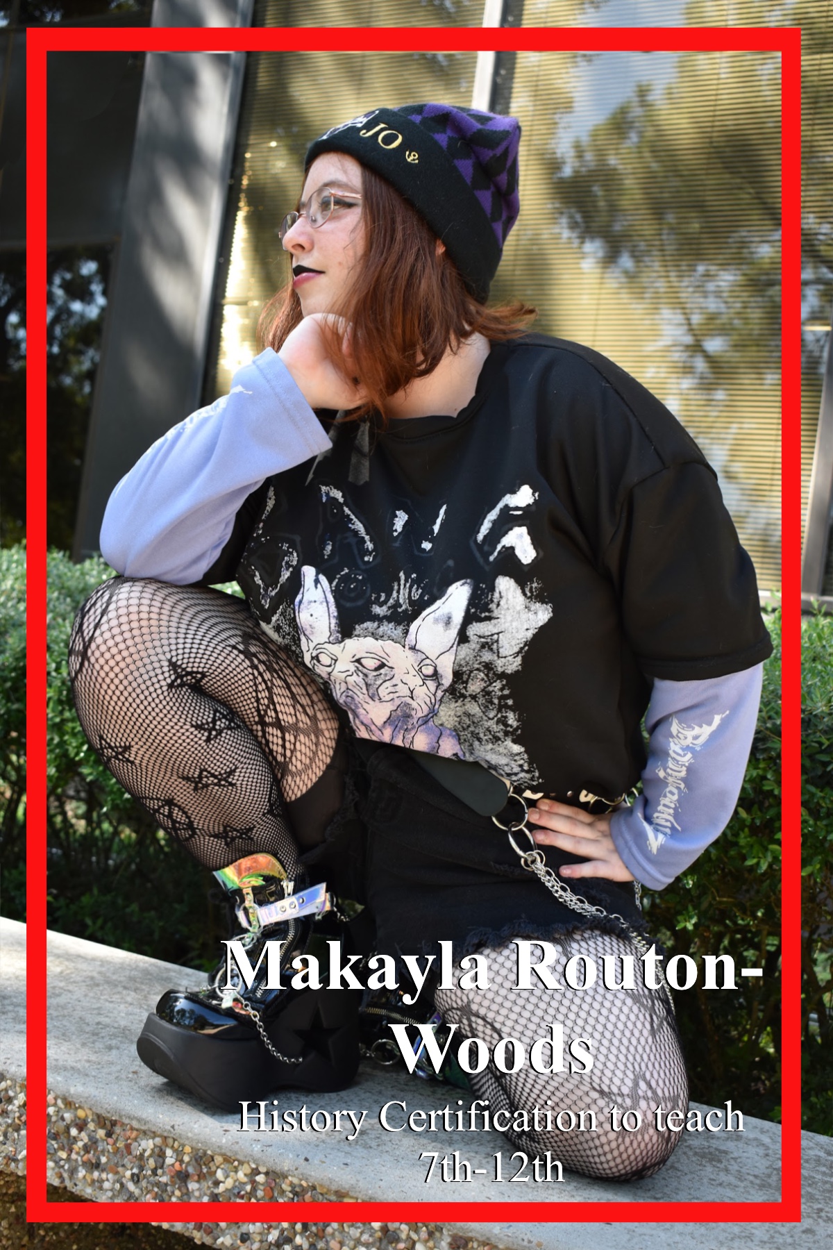 Makayla Routon-Woods, History Certification to teach 7th-12th, posing on a concrete bench outside of Bayou Building. Sporting a black and purple argyle beanie with a complementing graphic tee layered on top of a purple long-sleeved shirt tucked into black ripped shorts hoisted together by a spiked belt and chain. Pentacle and star fishnets layered under are tucked into black vinyl and chrome platform sneakers.