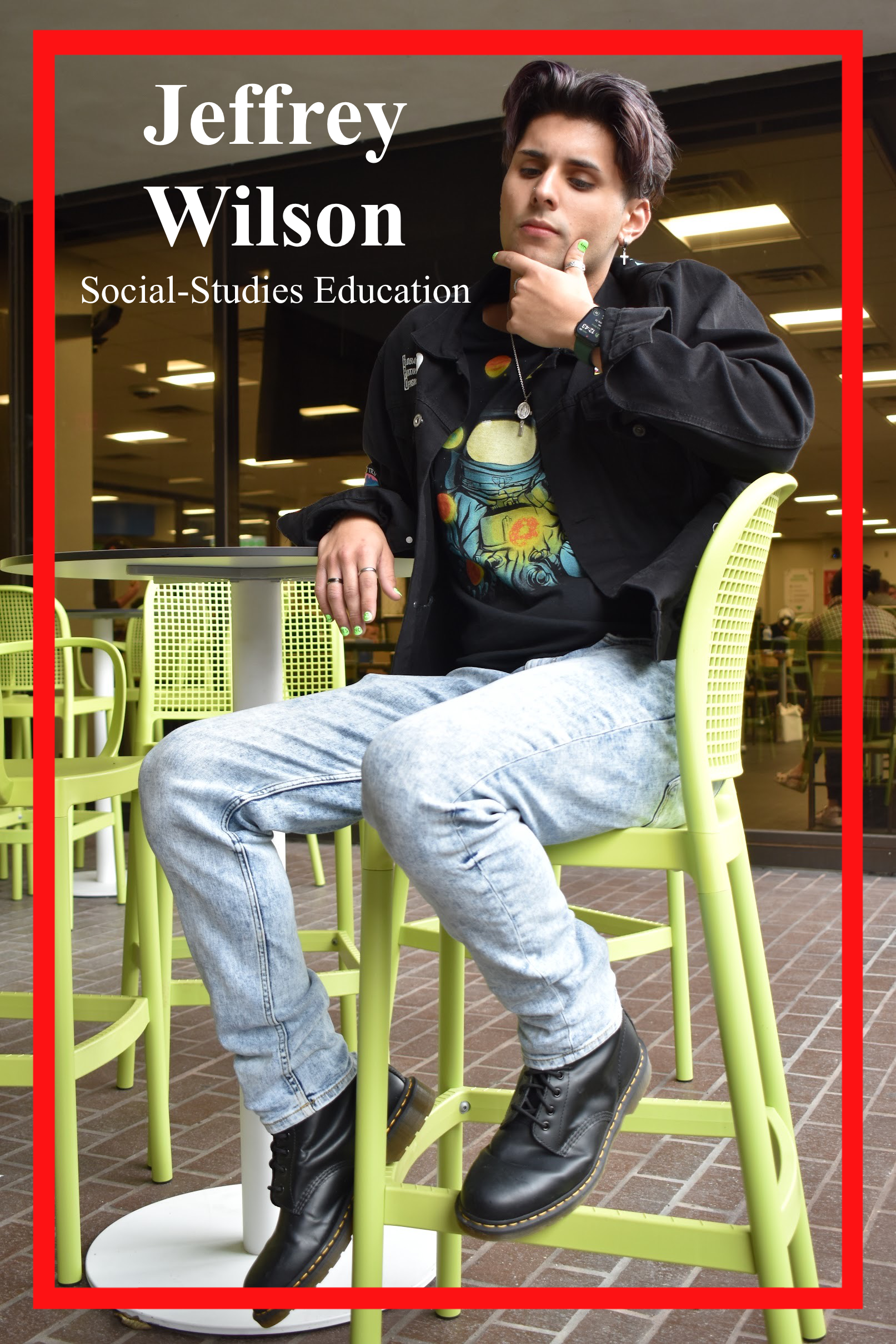 Jeffrey Wilson, Social-Studies Education Major, sits poised outside the patio café. Dressed clad in a graphic tee and windbreaker, styled with DocMartins.