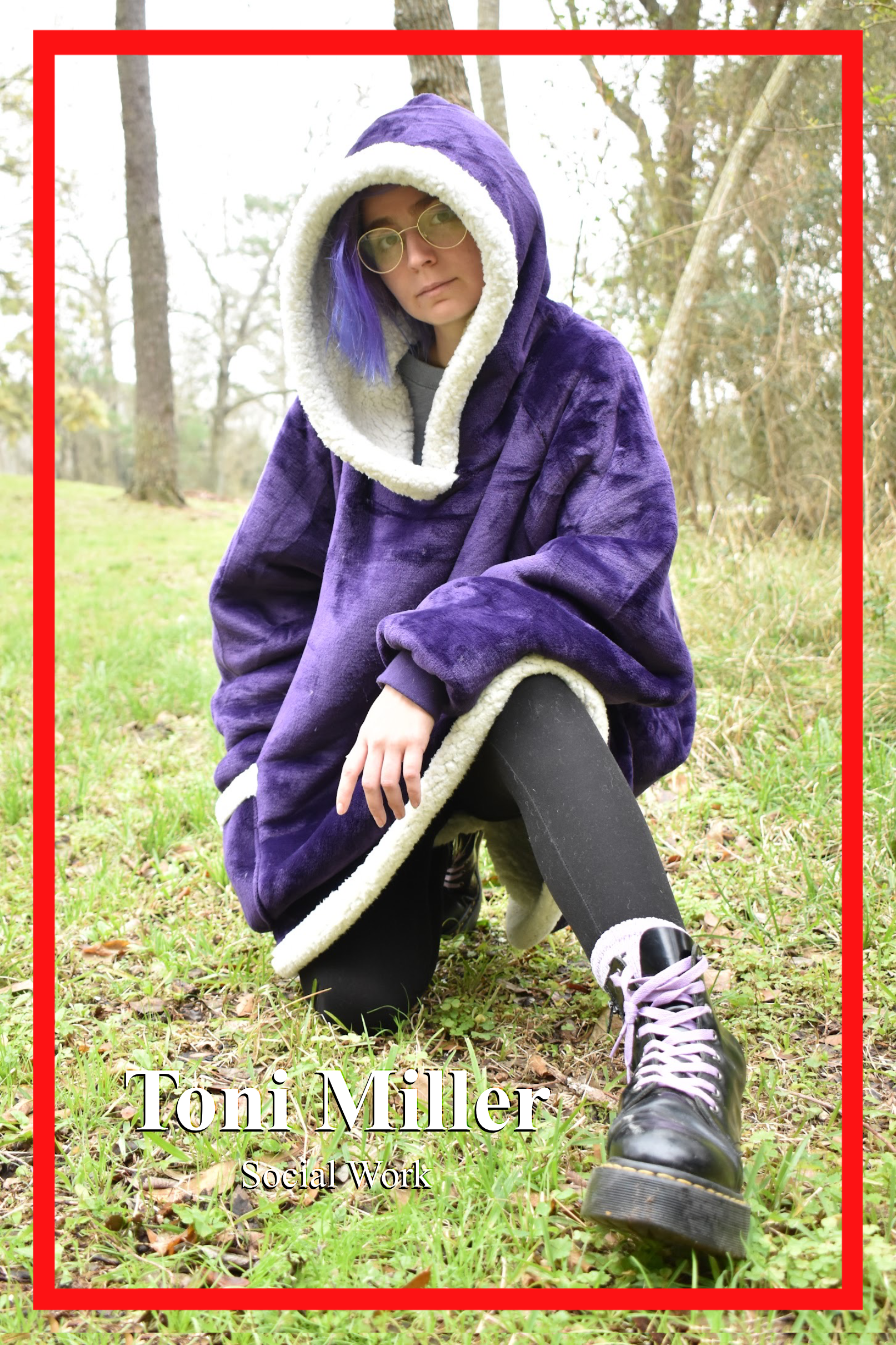 Toni Miller, Social Work Major, poses outside. Sporting a purple felted overcoat with a white fuzzy cotton lining with matching purple hair and laces on DocMartins.