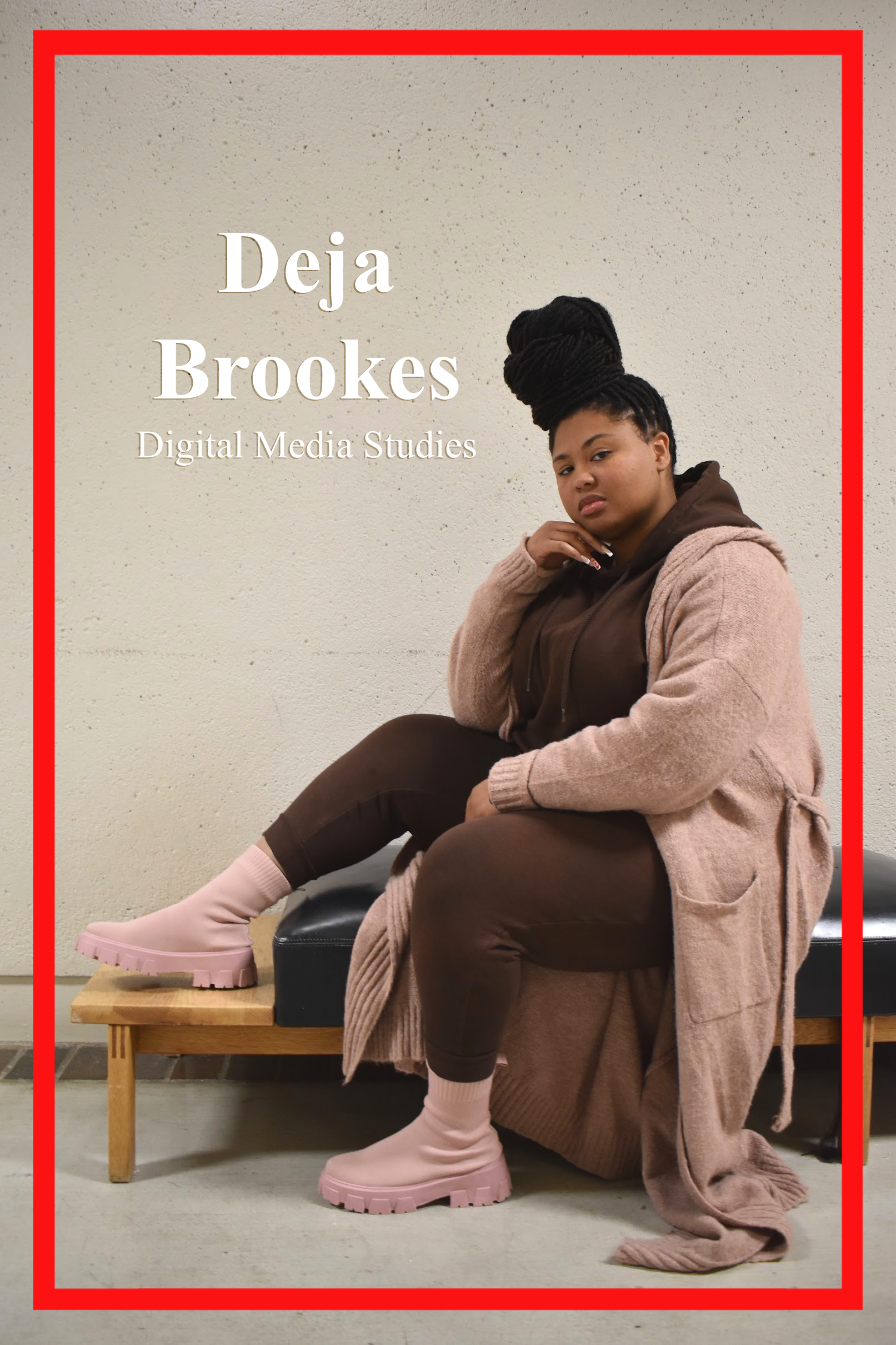 Deja Brookes, Digital Media Studies Major, poses on a bench in Arbor Central. Dressed in a matching brown track suit with a cotton dusty rose cardigan and boots.